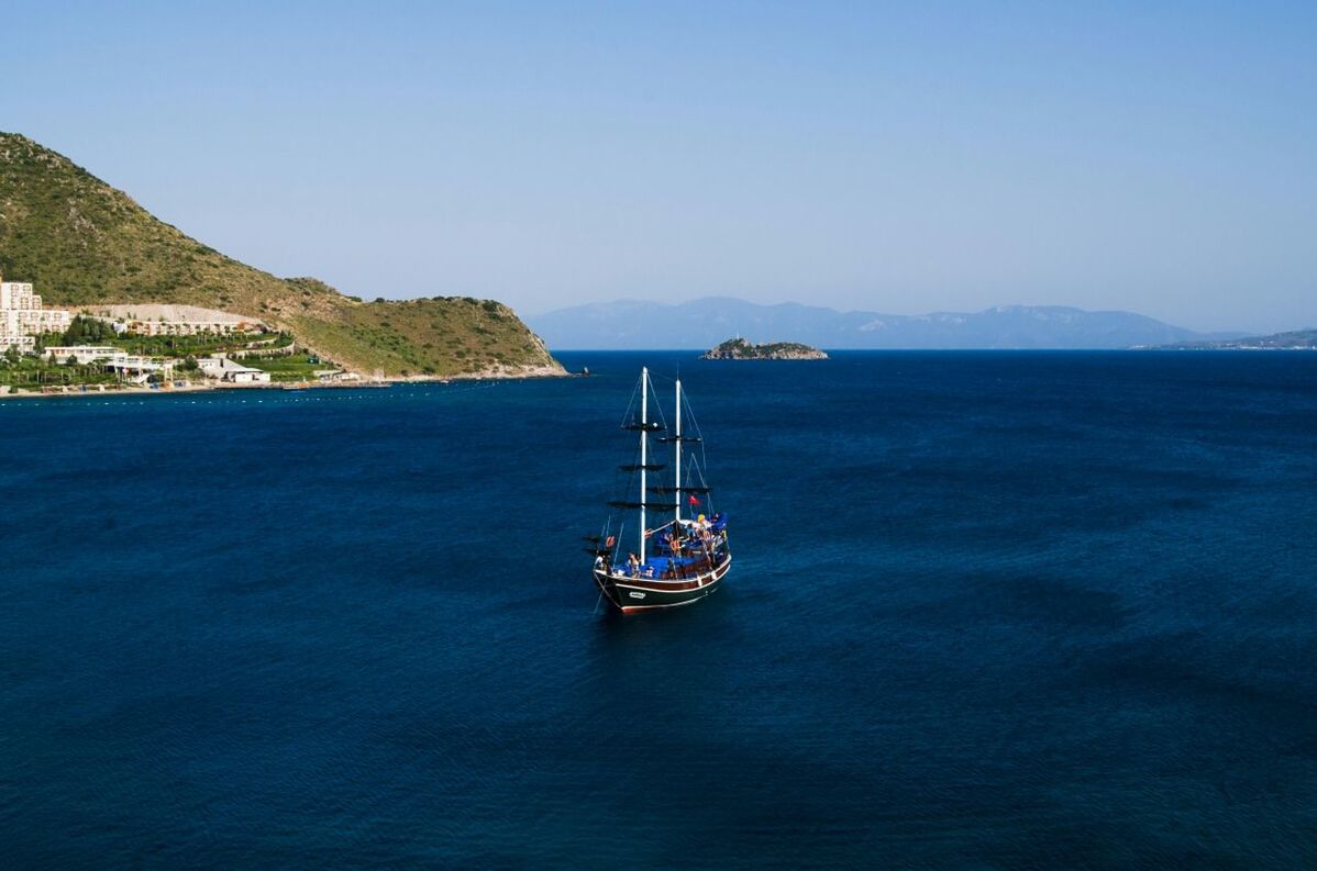 High angle view of a boat in calm blue sea