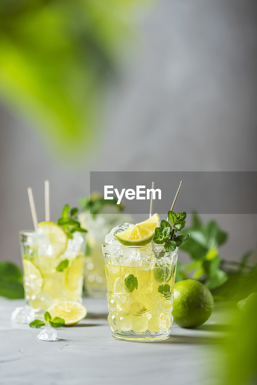 CLOSE-UP OF DRINK ON GLASS OF JUICE