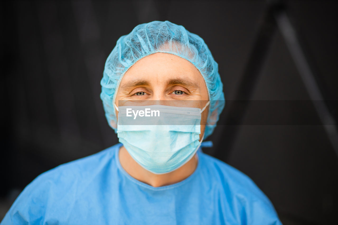 Portrait of man wearing surgical mask