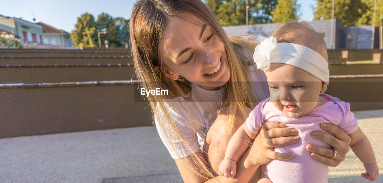 Mother and daughter outdoors