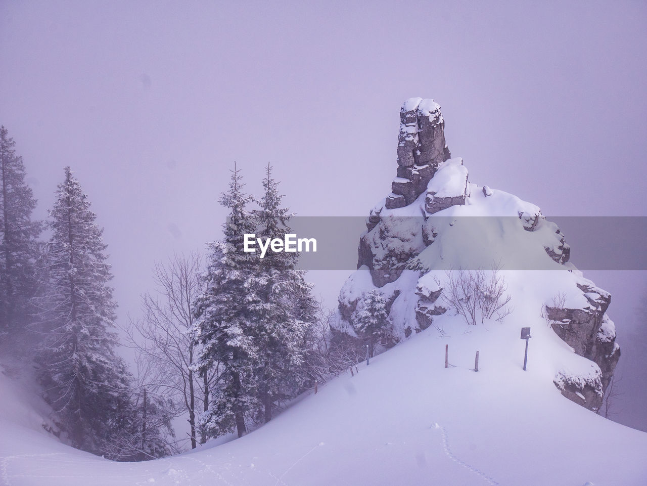 Scenic view of snow covered mountain against sky