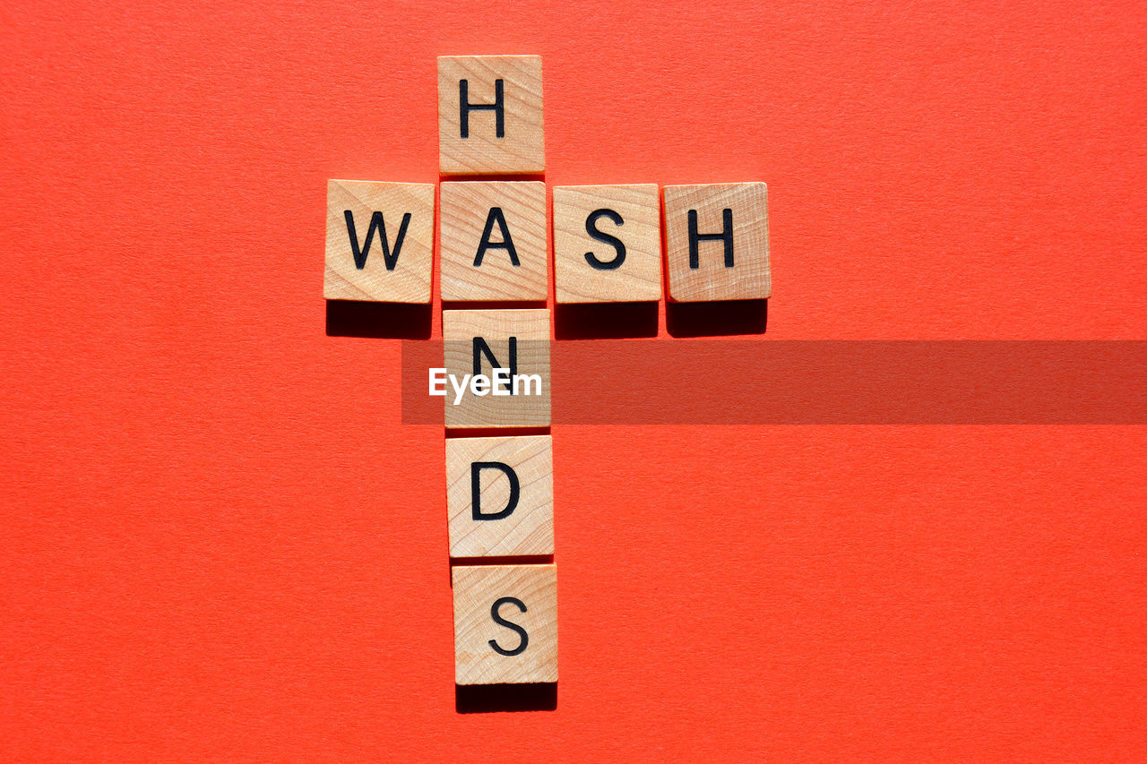 Wash hands crossword on red background