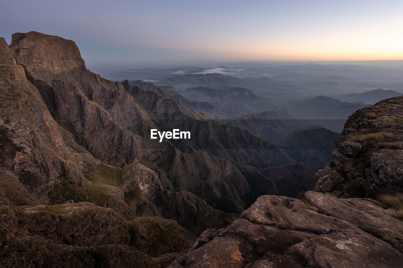 Scenic view of mountains against sky during sunset