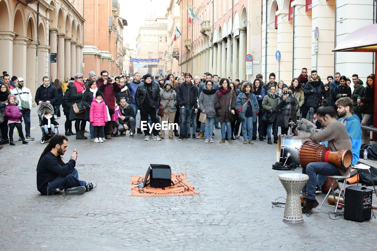 PEOPLE WALKING ON CITY STREET