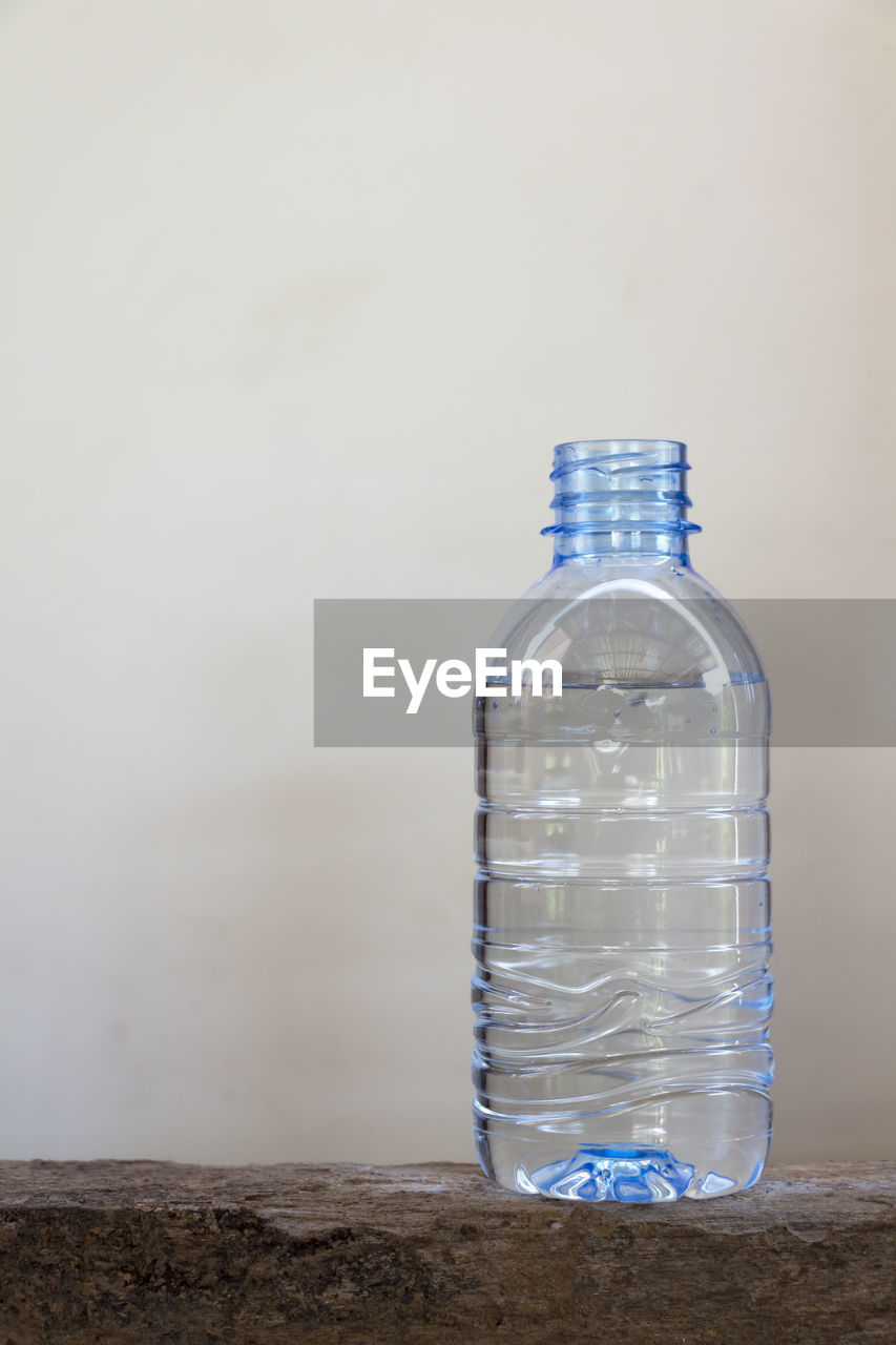 Close-up of water bottle on table