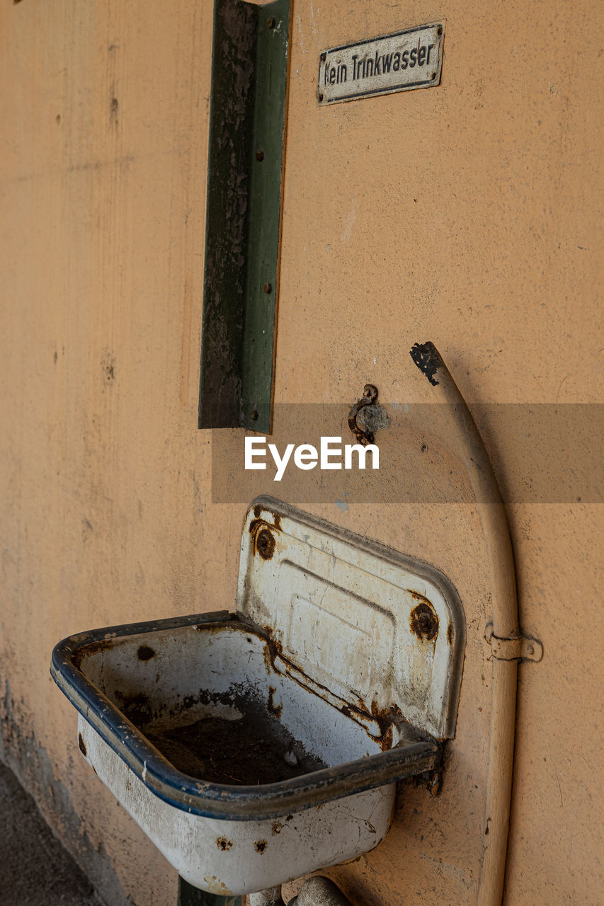 plumbing fixture, no people, sink, wall, old, wood, wall - building feature, metal, floor, room, iron, abandoned, bathroom, indoors, architecture