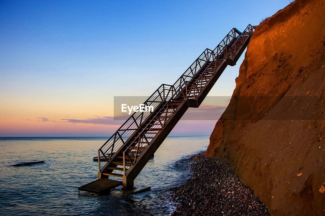 Steps leading into sea from a cliff