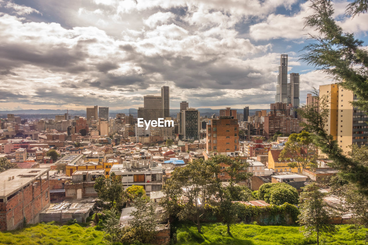 Buildings in city against sky