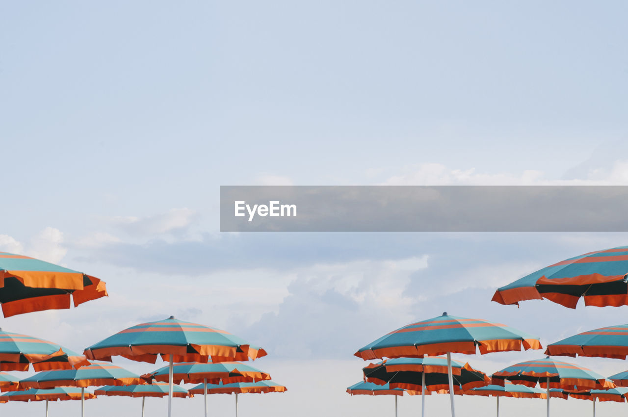 BOATS IN SEA AGAINST CLOUDY SKY