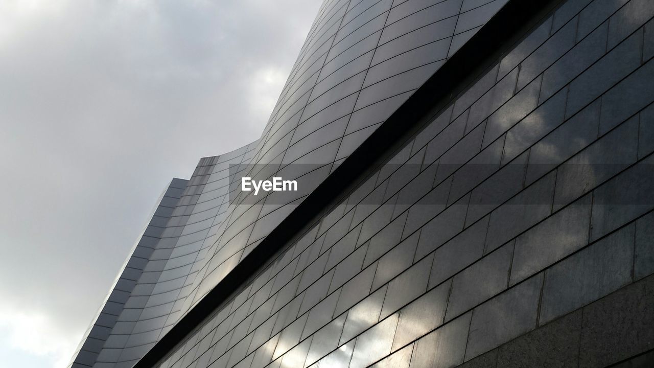 Low angle view of office building against sky