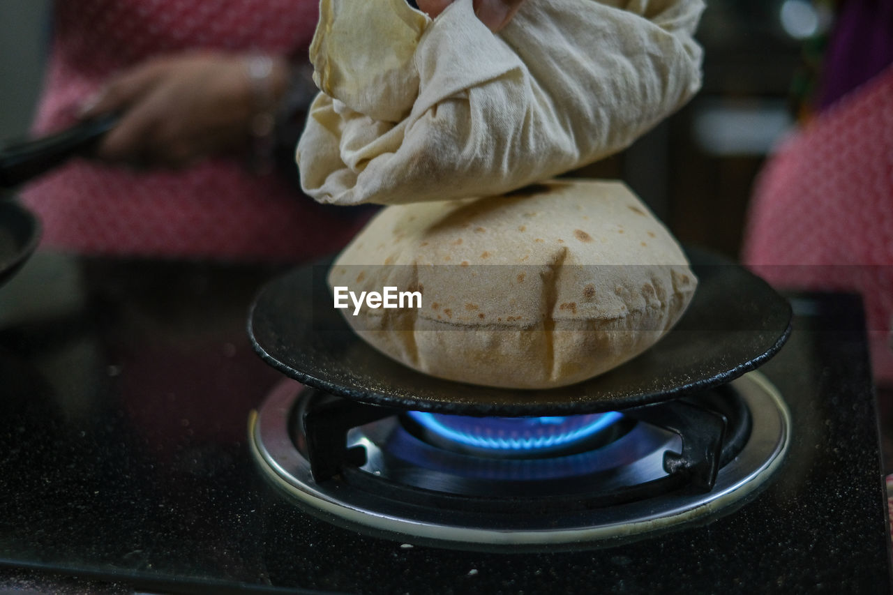Traditional indian roti bread backed on gas stove