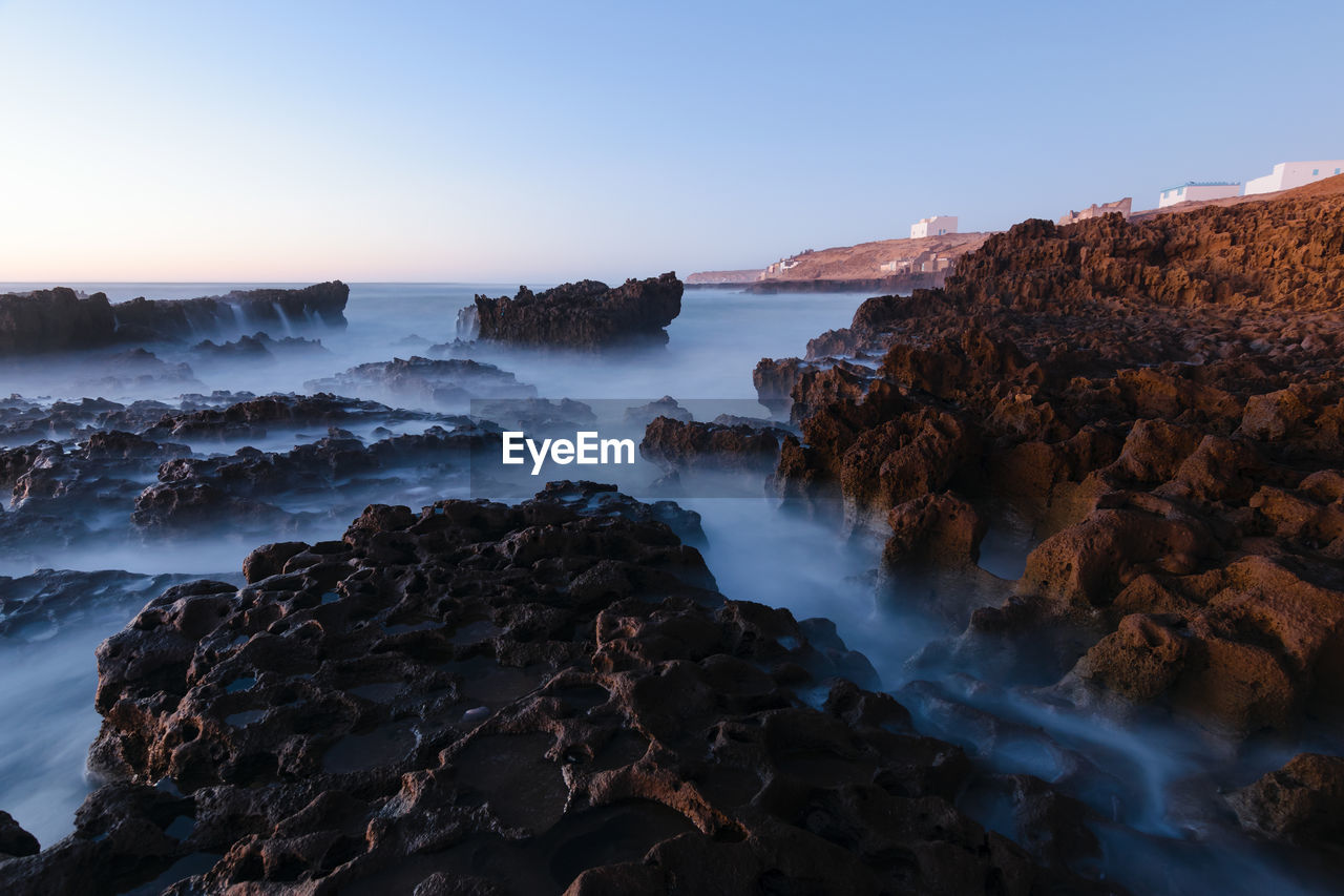 Scenic view of sea against clear sky