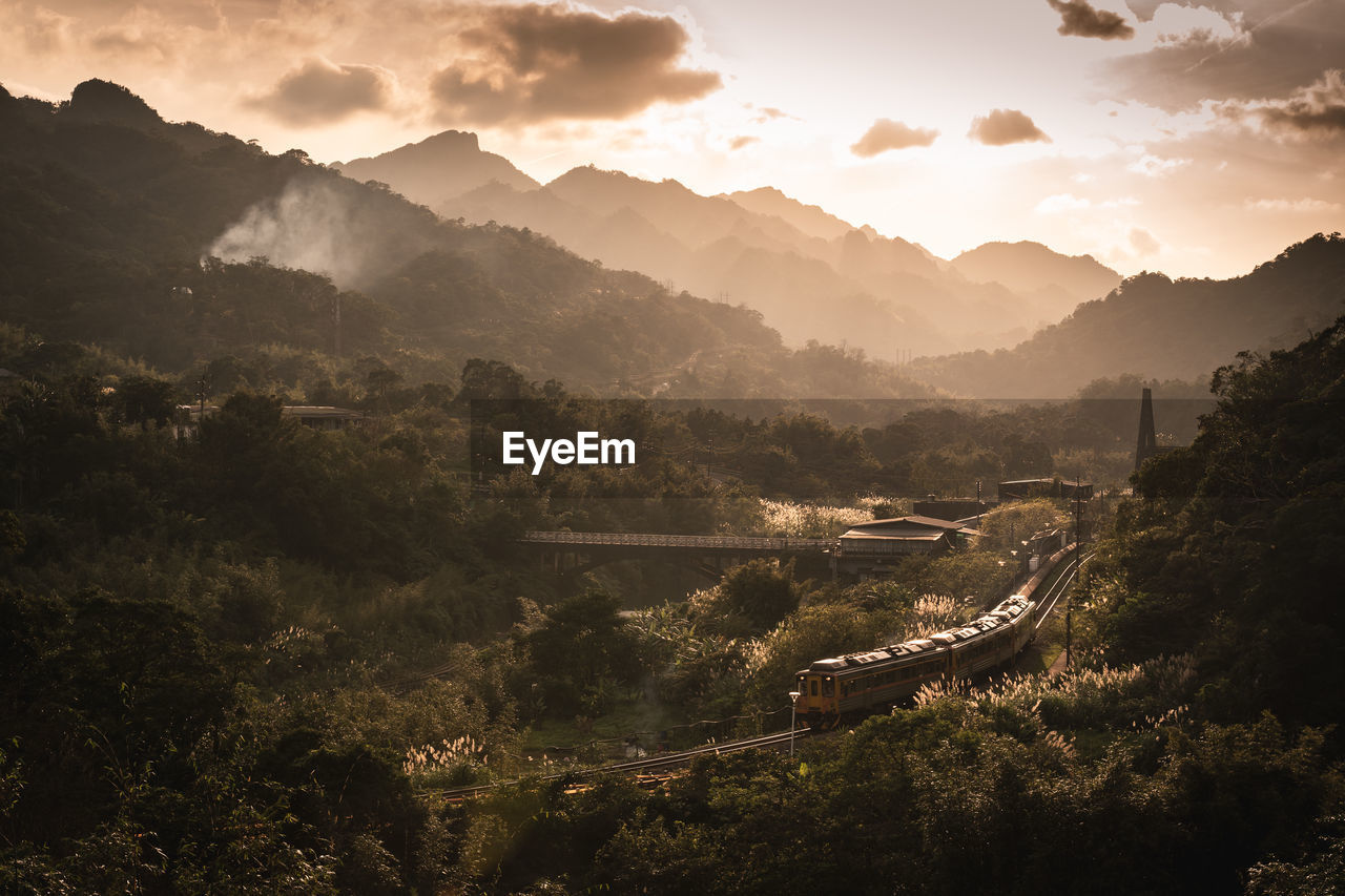 Train in the mountains during sunset
