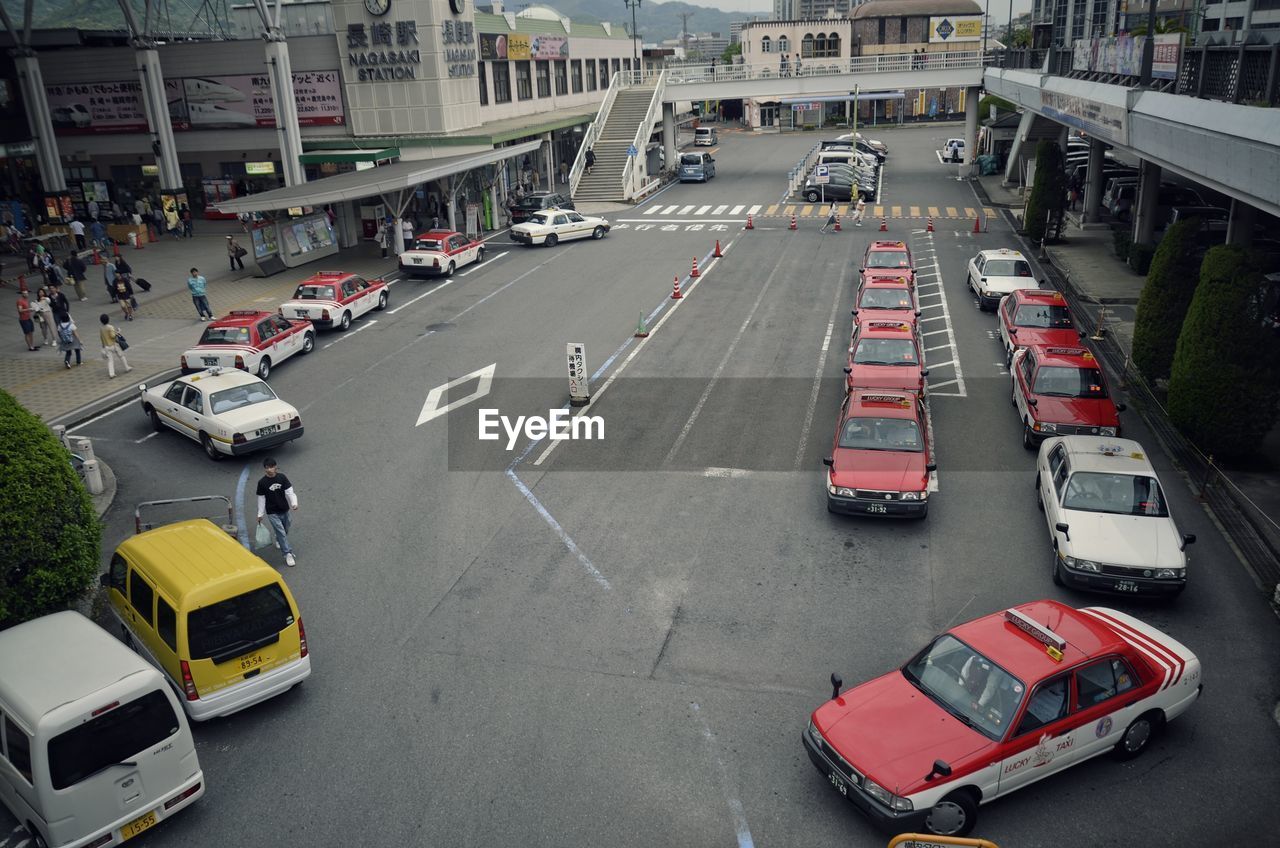 High angle view of cars and taxies on road by station