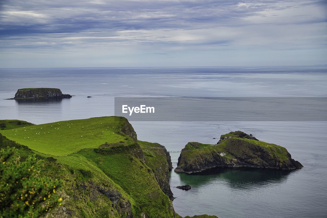 water, sea, scenics - nature, beauty in nature, coast, sky, land, rock, horizon, ocean, cliff, shore, nature, tranquility, body of water, tranquil scene, beach, cloud, horizon over water, reflection, no people, terrain, bay, islet, idyllic, non-urban scene, day, cove, outdoors, rock formation, plant, coastline, environment, landscape, travel destinations, island, travel