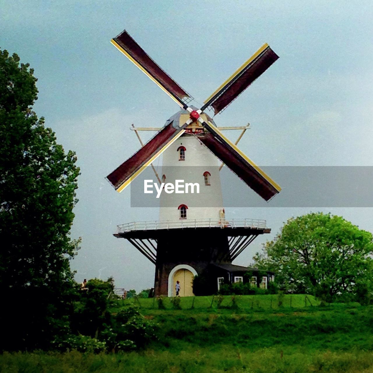 View of traditional windmill against sky