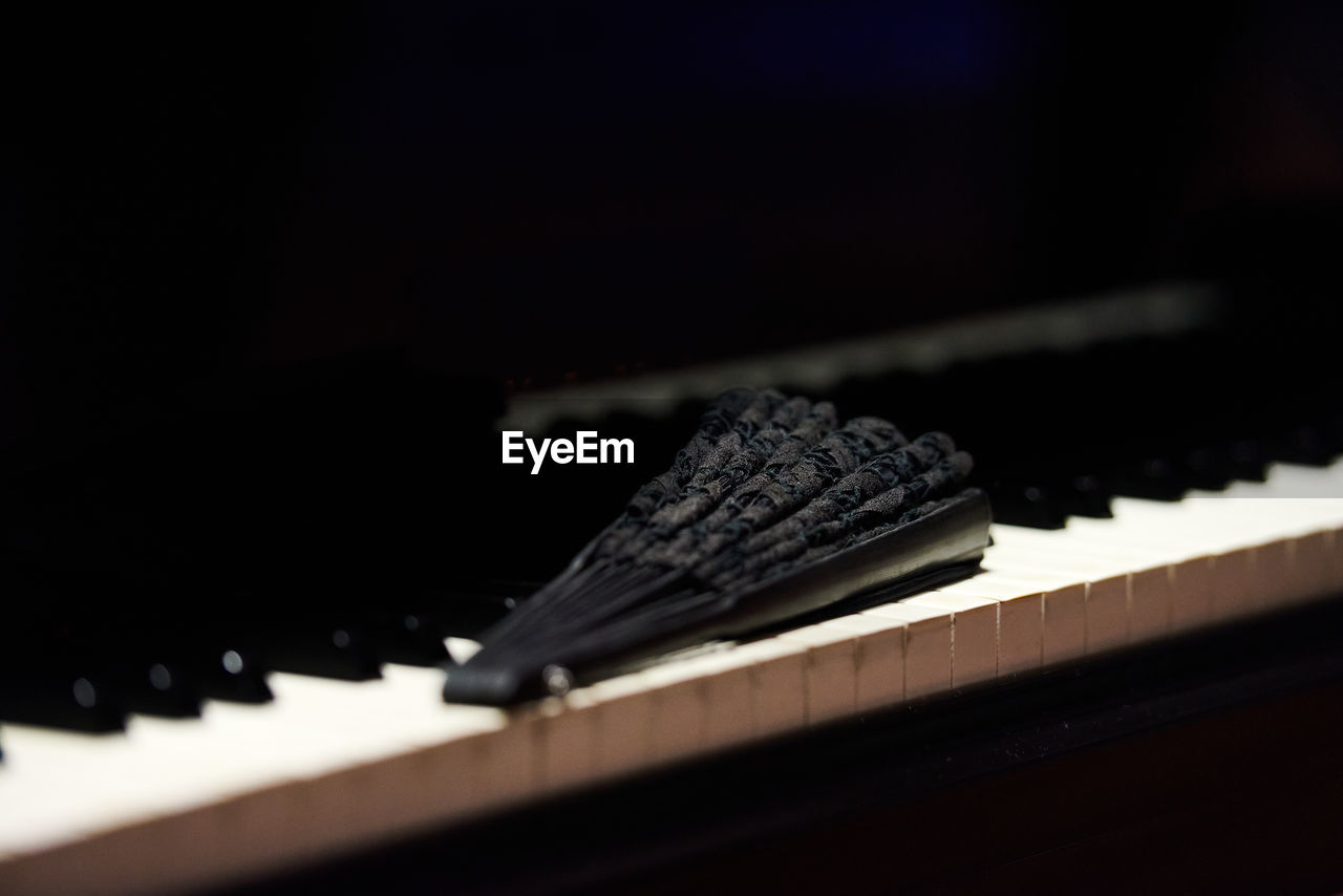 CLOSE-UP OF PIANO ON TABLE