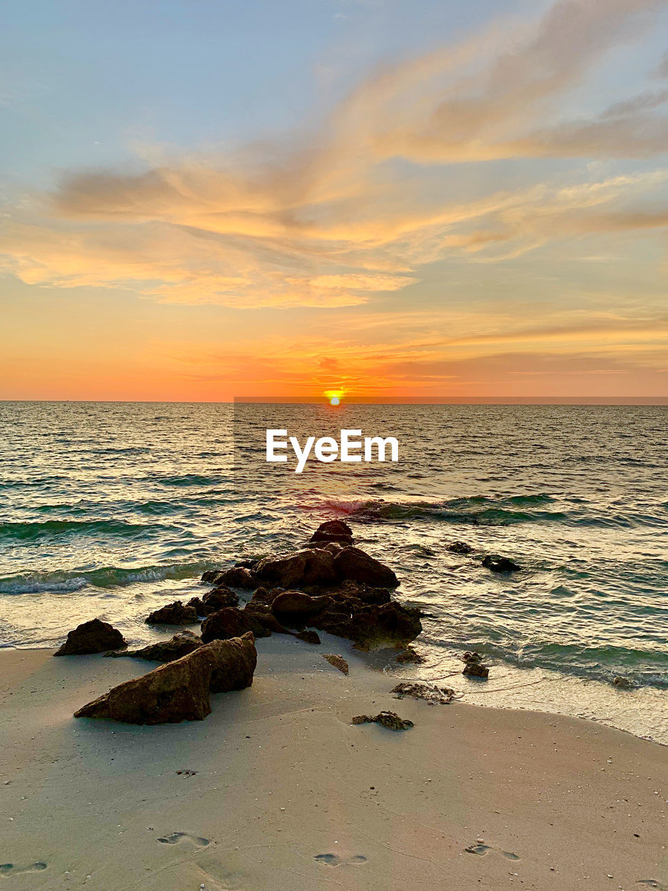 Scenic view of sea against sky during sunset