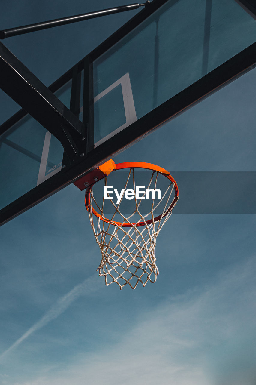 Low angle view of basketball hoop against sky