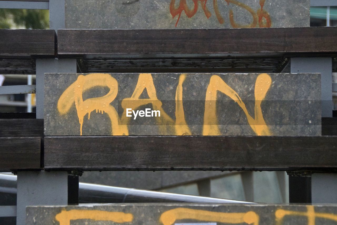 Close-up of text on railing