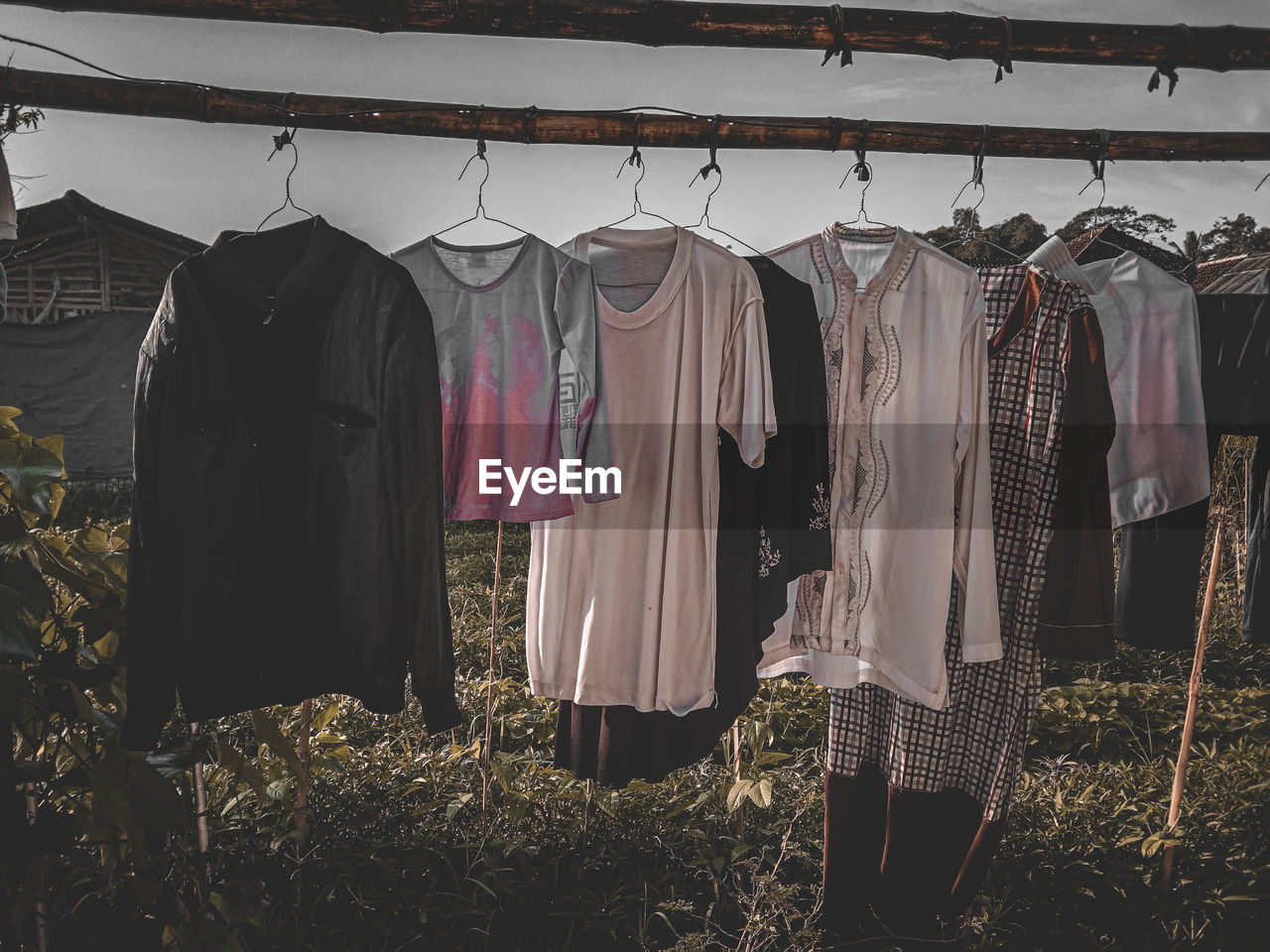 ROW OF CLOTHES DRYING ON CLOTHESLINE