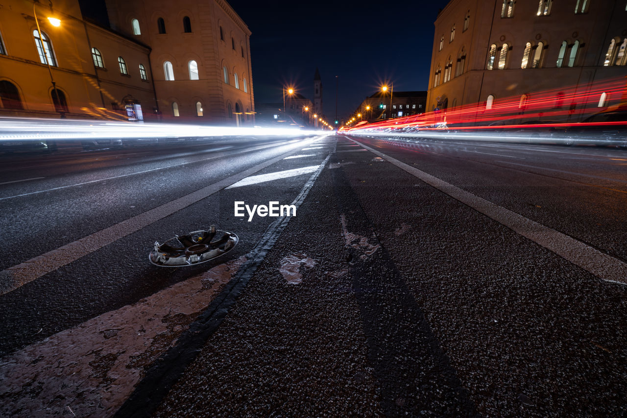 Light trails on road in city at night