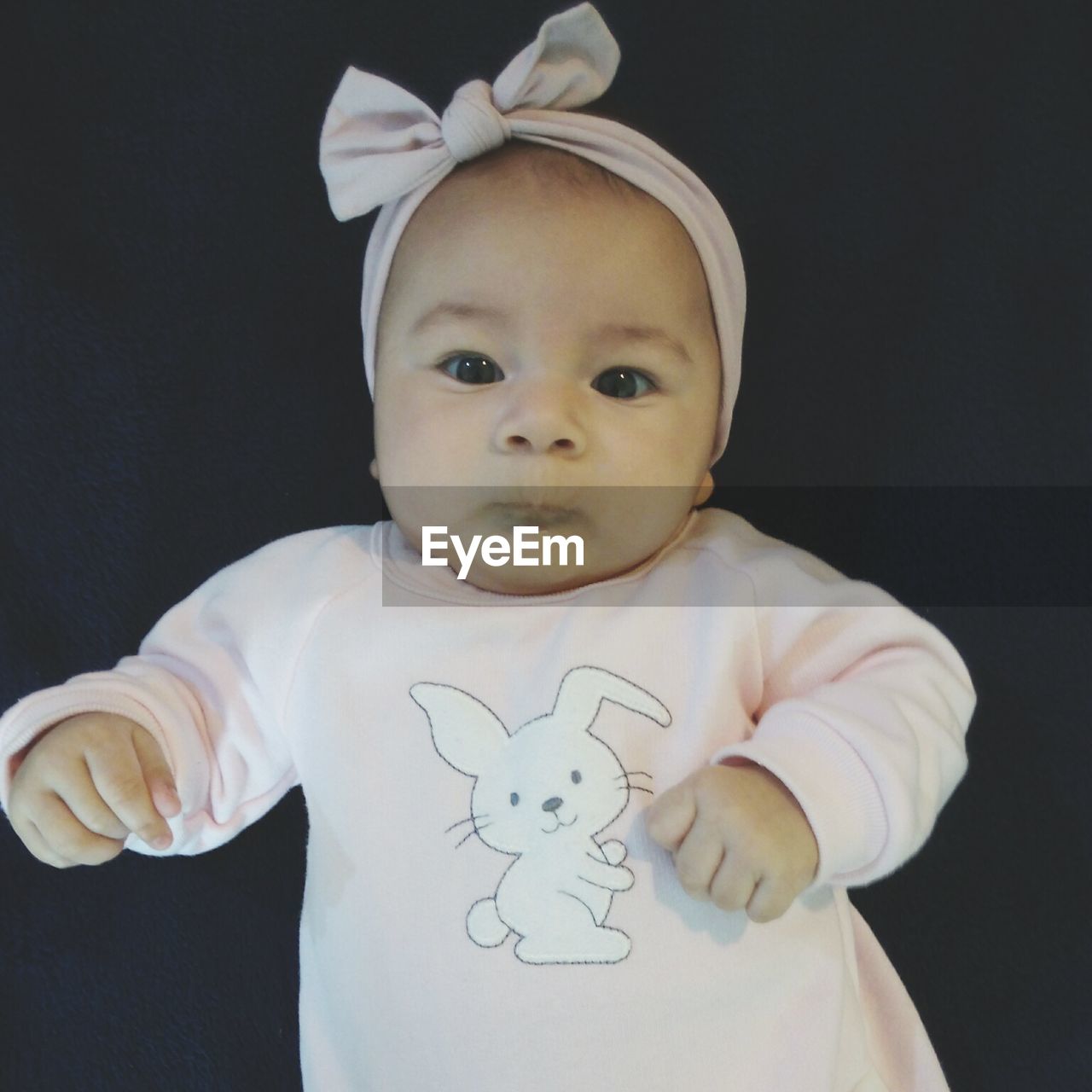 CLOSE-UP PORTRAIT OF CUTE BABY GIRL WEARING MASK