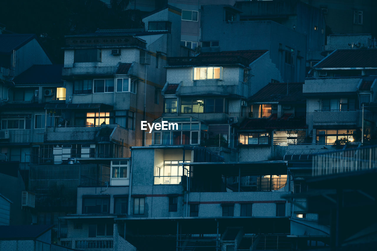 Warm lights from house in the city