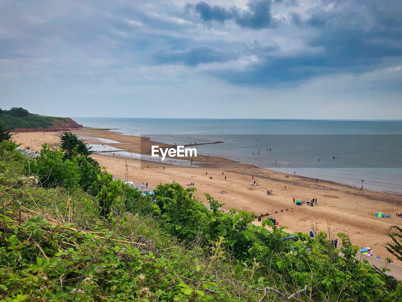 SCENIC VIEW OF SEA SHORE AGAINST SKY