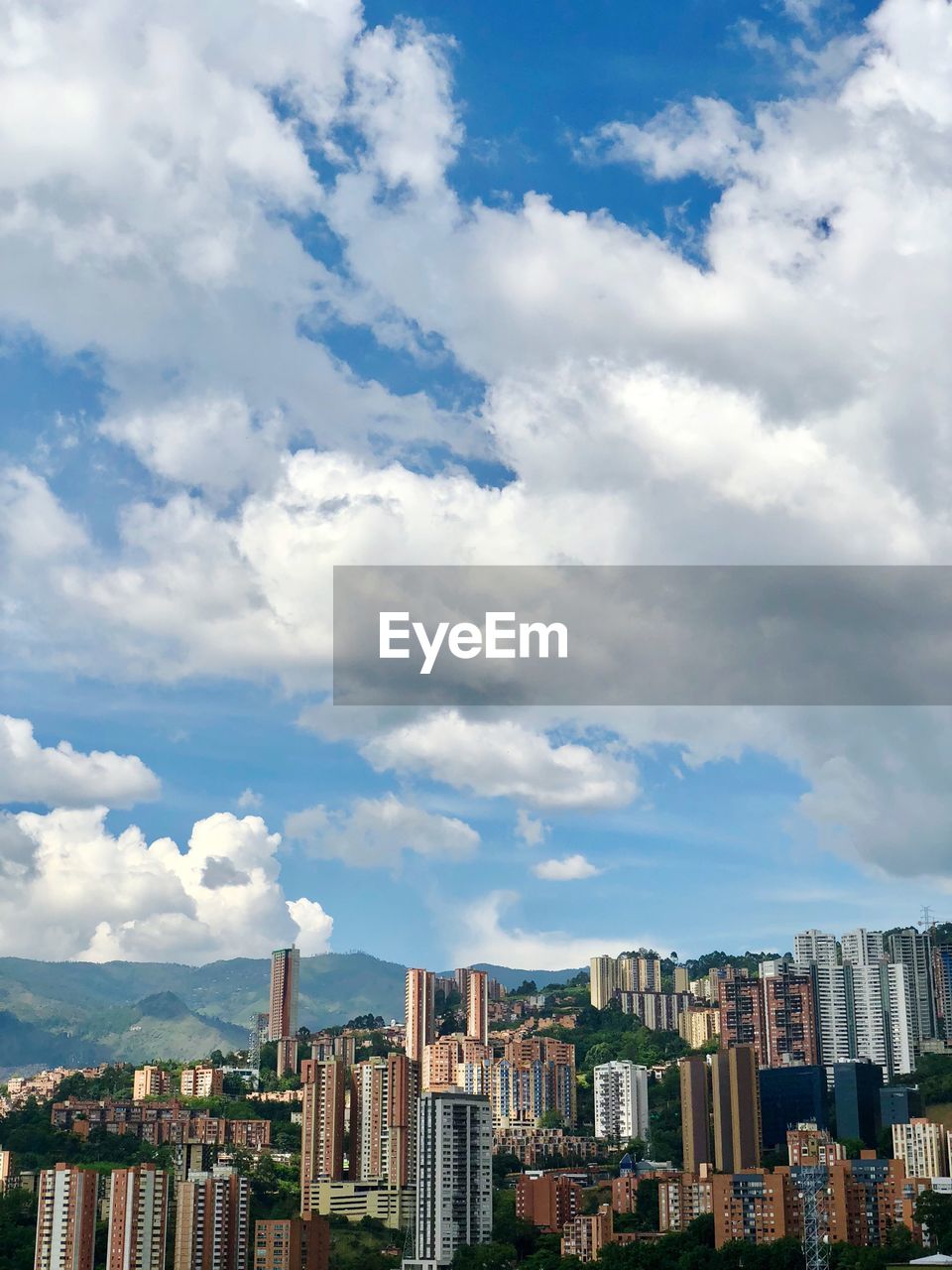 Buildings in city against sky