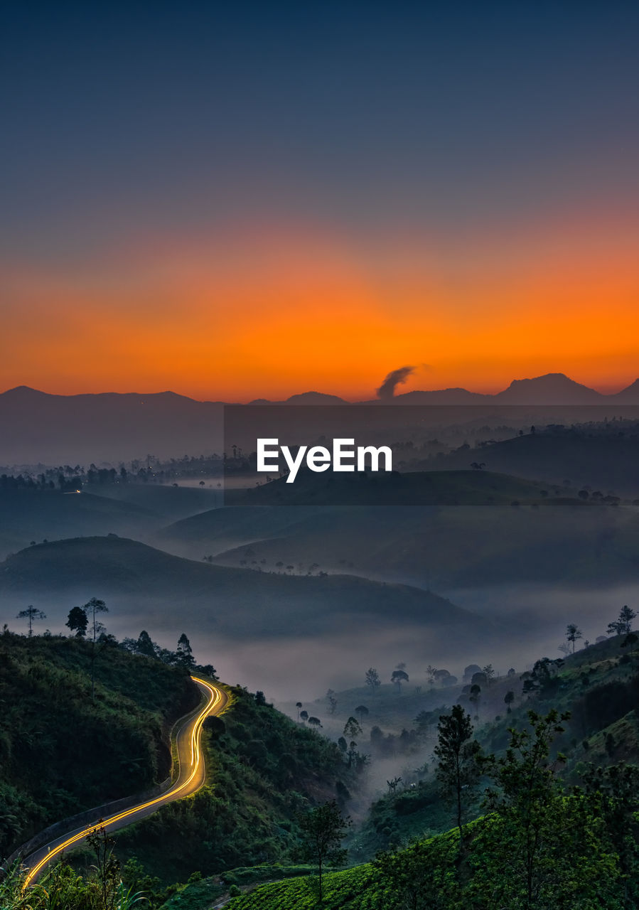 Scenic view of landscape against sky during sunset