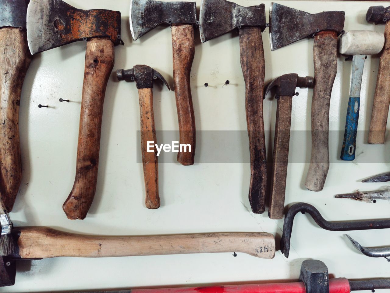 hammer and tools on wooden wall