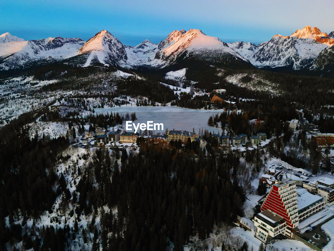 scenic view of snowcapped mountains against sky during sunset