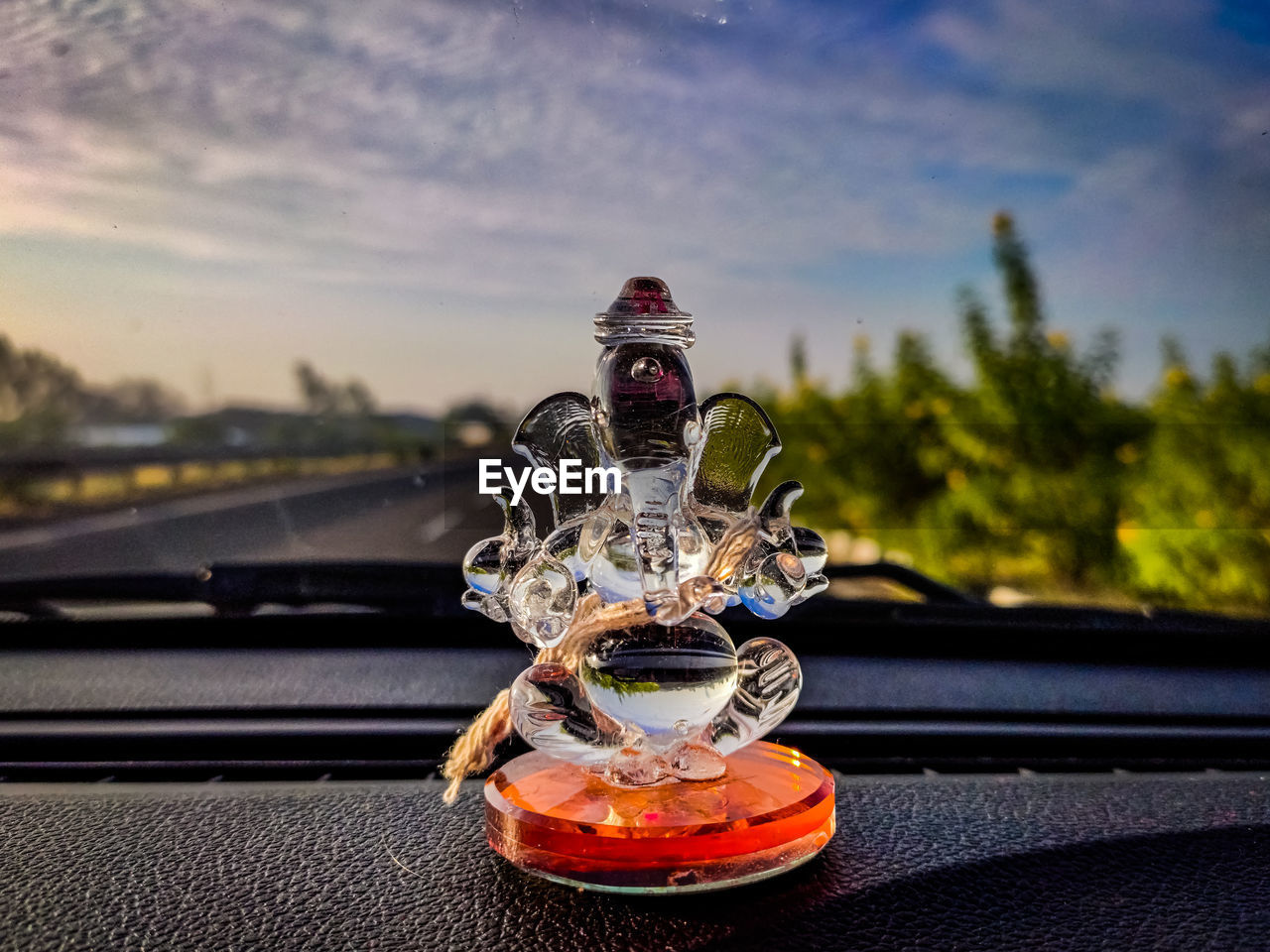 Close-up of ganesh statue on dashboard