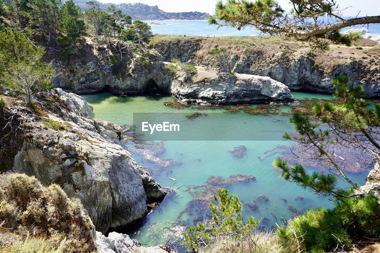 Scenic view of rocks by sea