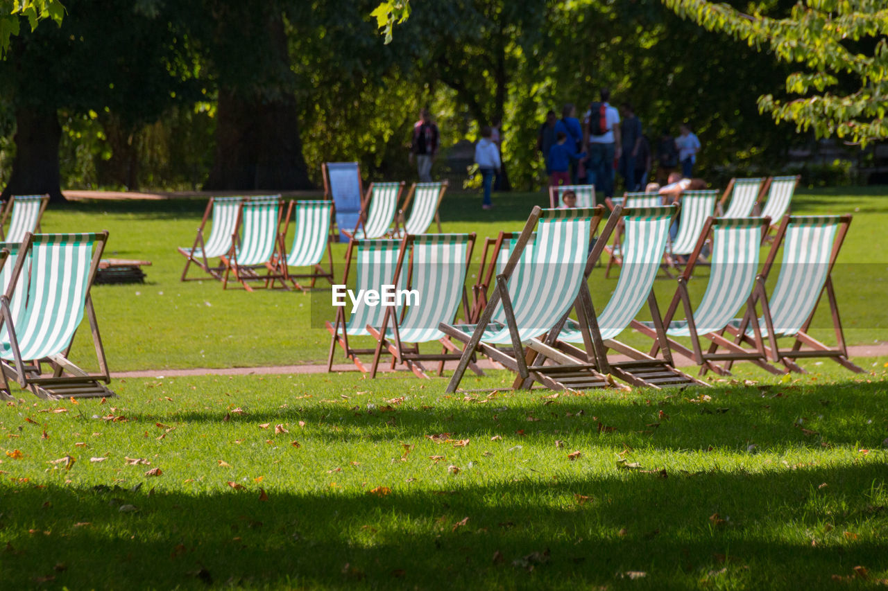 Empty chairs in park