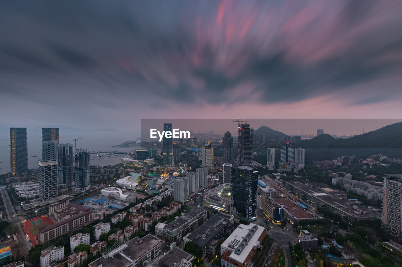 High angle view of buildings against sky during sunset