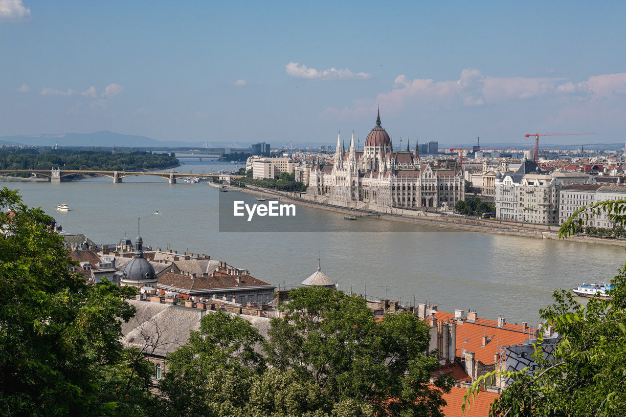 architecture, built structure, building exterior, city, water, travel destinations, river, sky, building, travel, nature, cityscape, tourism, bridge, town, high angle view, the past, transportation, history, vacation, no people, coast, cloud, government, tree, nautical vessel, plant, outdoors, place of worship, day, landscape, politics and government, religion, skyline, tower, bay, landmark, body of water, mode of transportation, dome, aerial view, urban skyline, blue