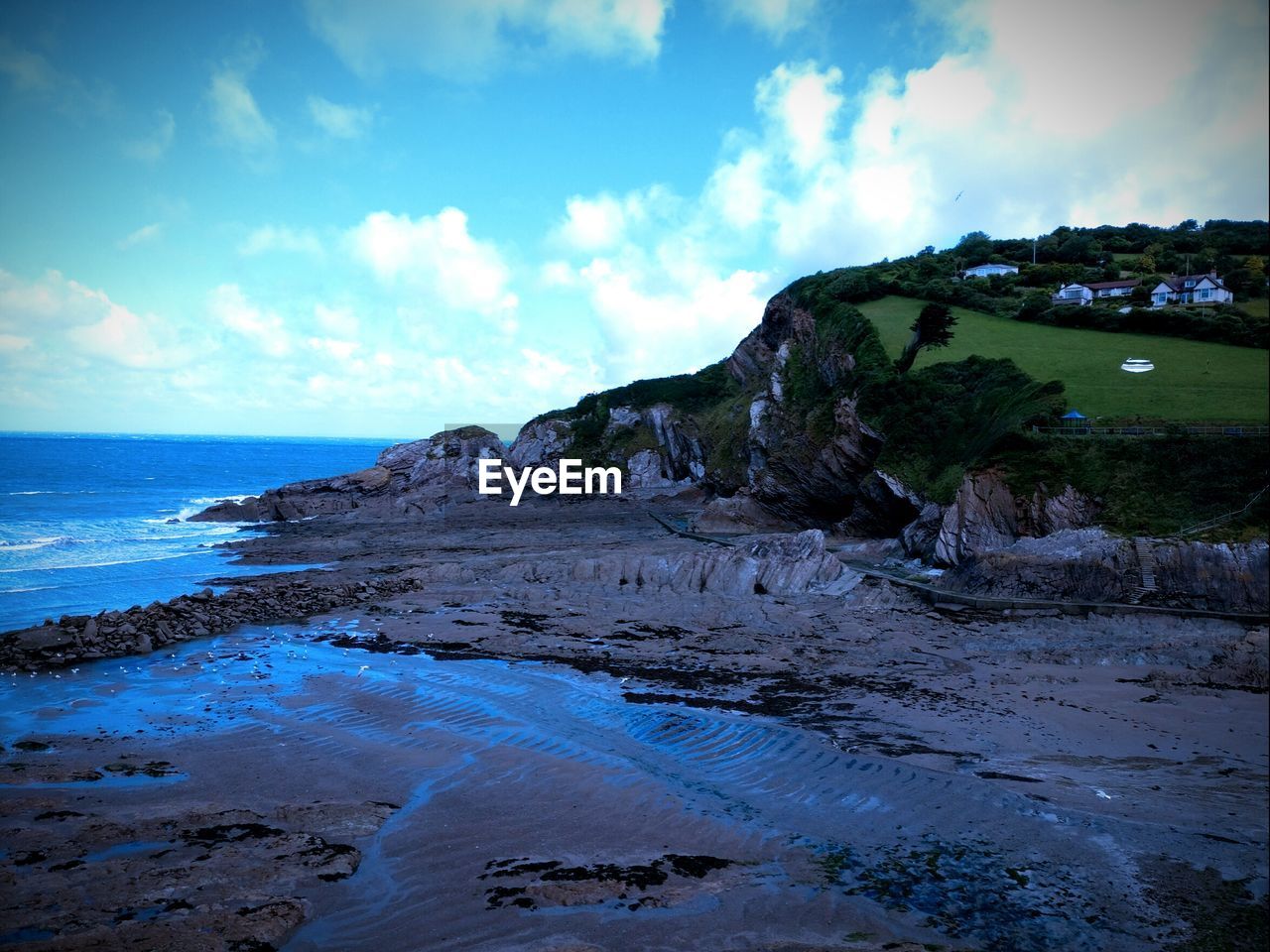 SCENIC VIEW OF SEA AND LANDSCAPE AGAINST SKY