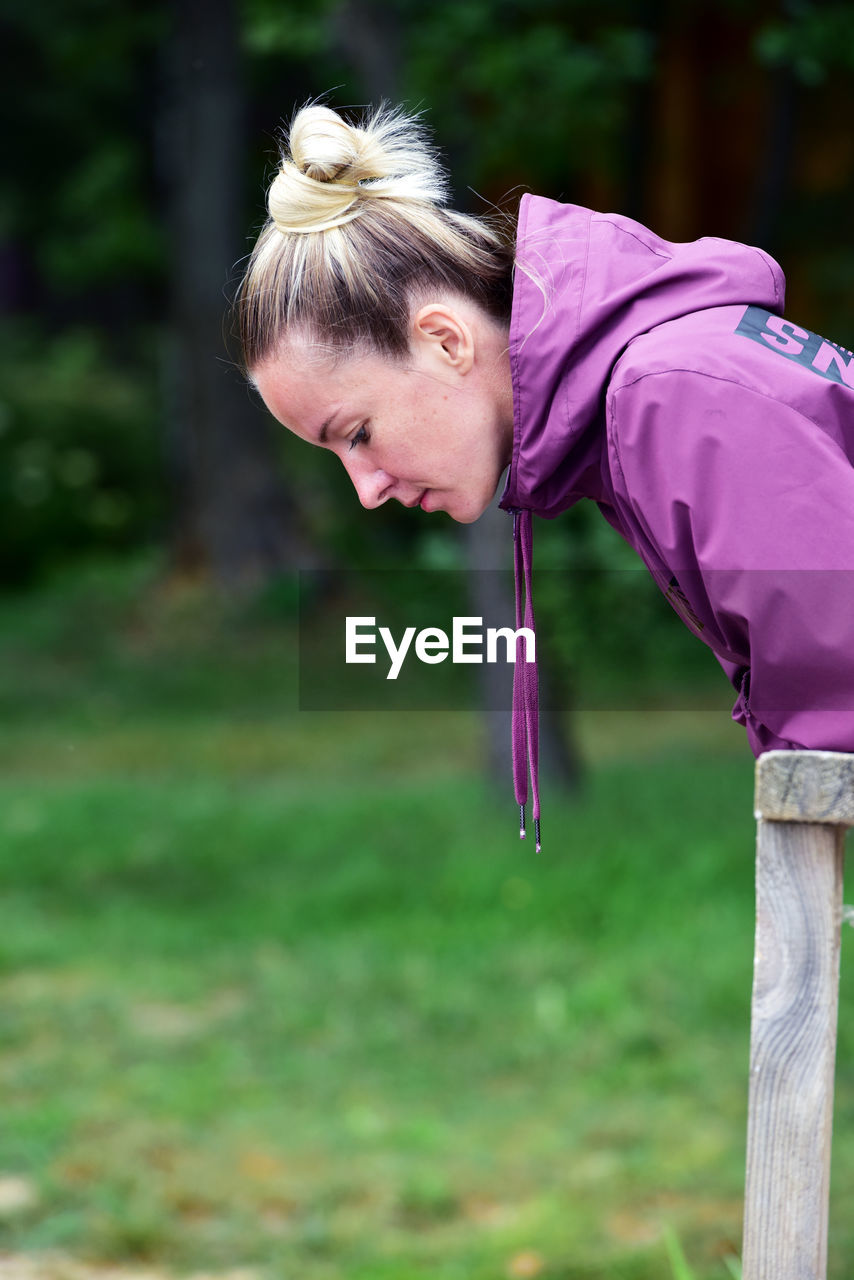 Side view of woman standing outdoors