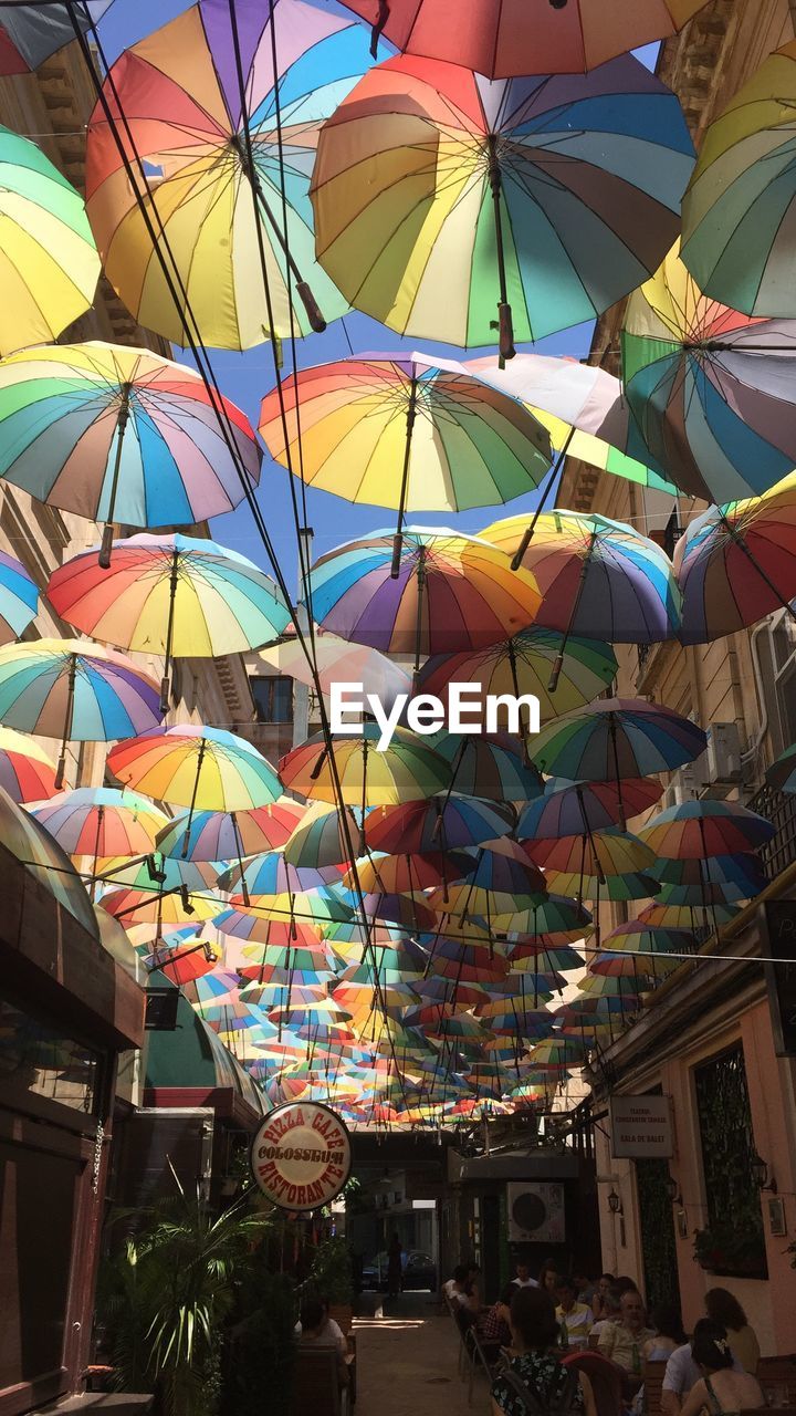 LOW ANGLE VIEW OF MULTI COLORED BUILDINGS