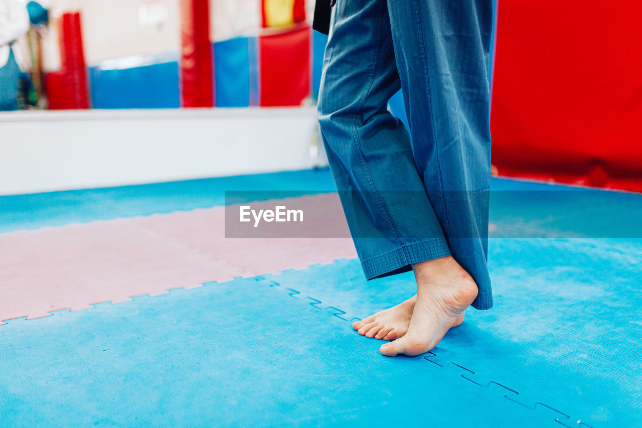 Low section of man standing on floor