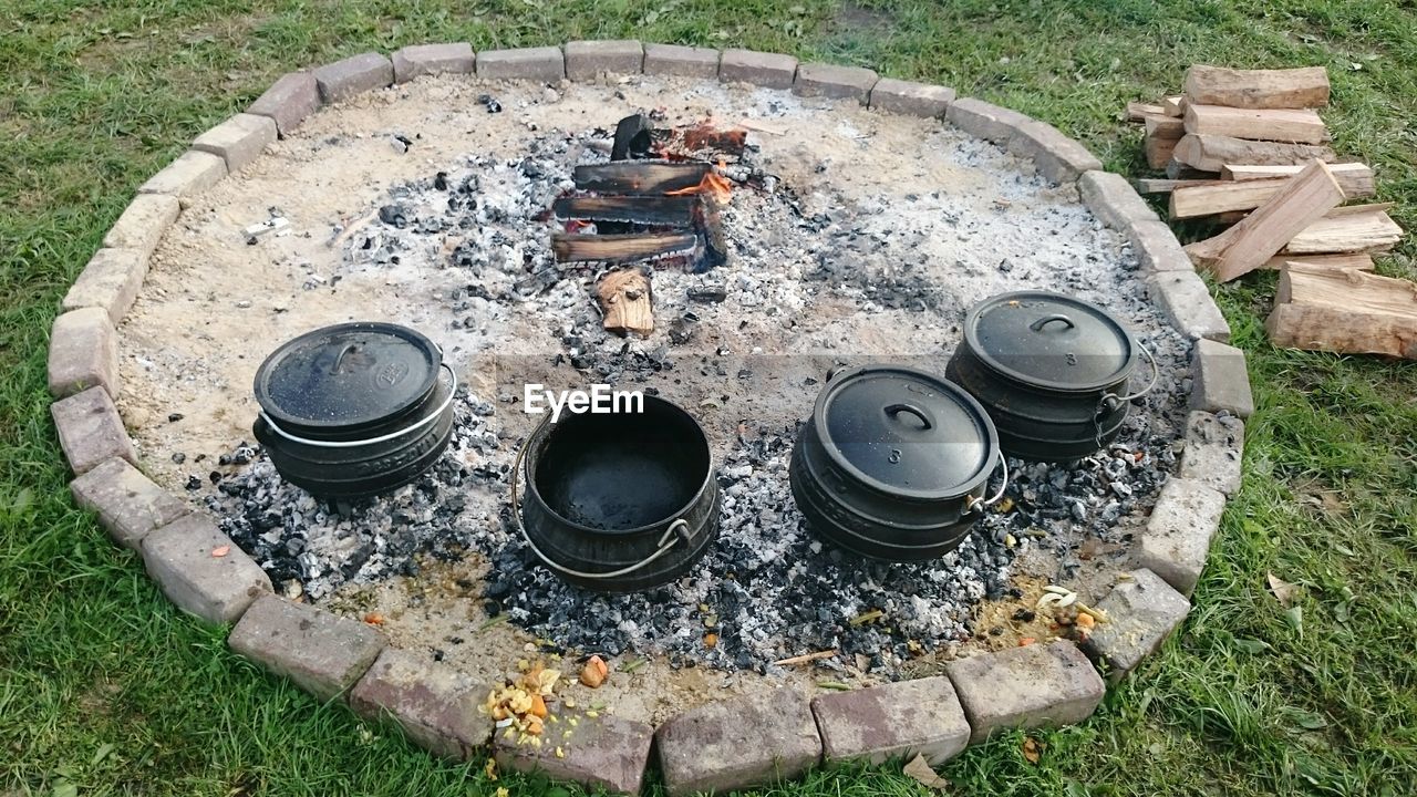 High angle view of utensils by burning chulah