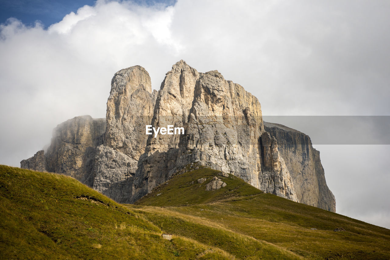 LOW ANGLE VIEW OF ROCK FORMATION ON LAND AGAINST SKY