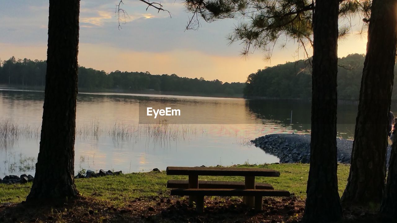 Scenic view of calm lake at sunset