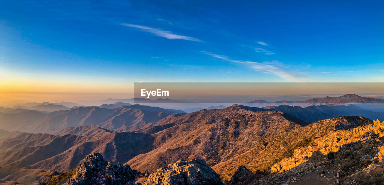 Scenic view of mountains against sky during sunset