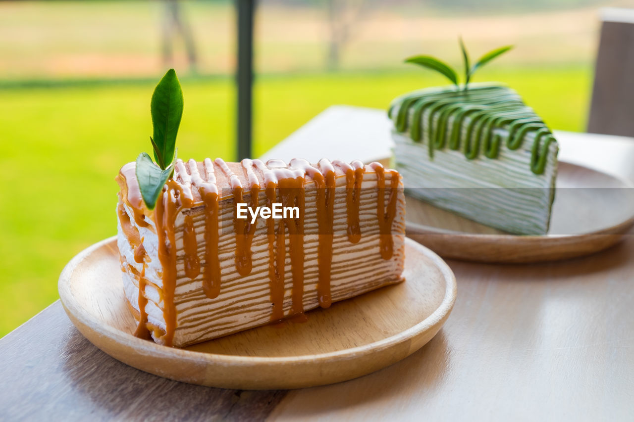 CLOSE-UP OF CAKE SLICE ON TABLE