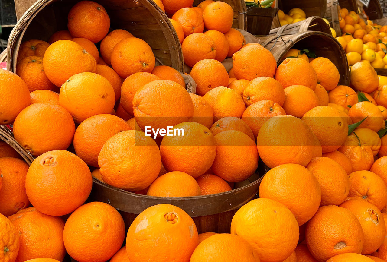 Basket of fresh oranges at farmers market