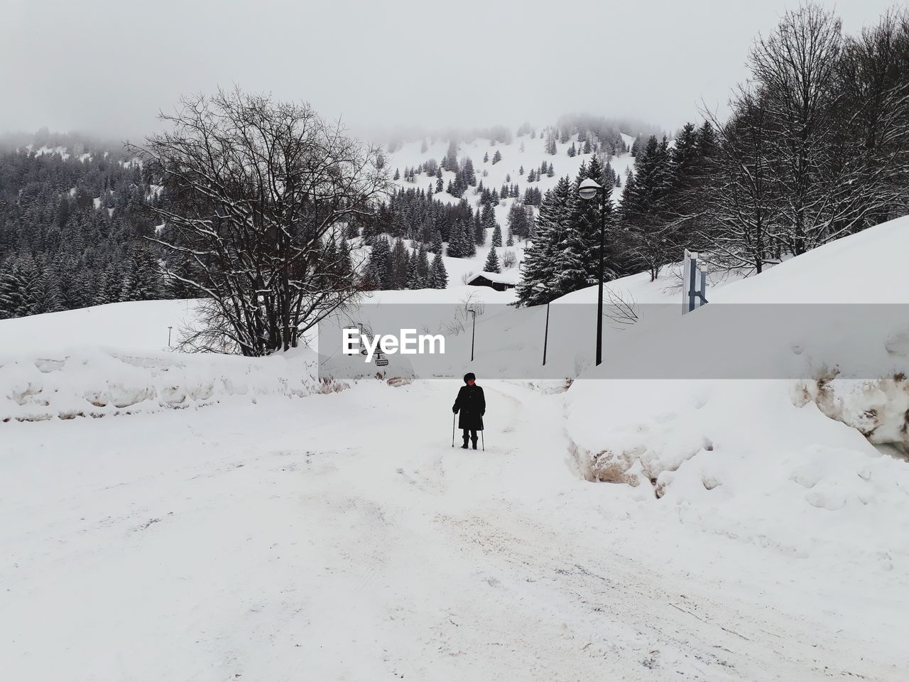 Man standing on snow covered landscape