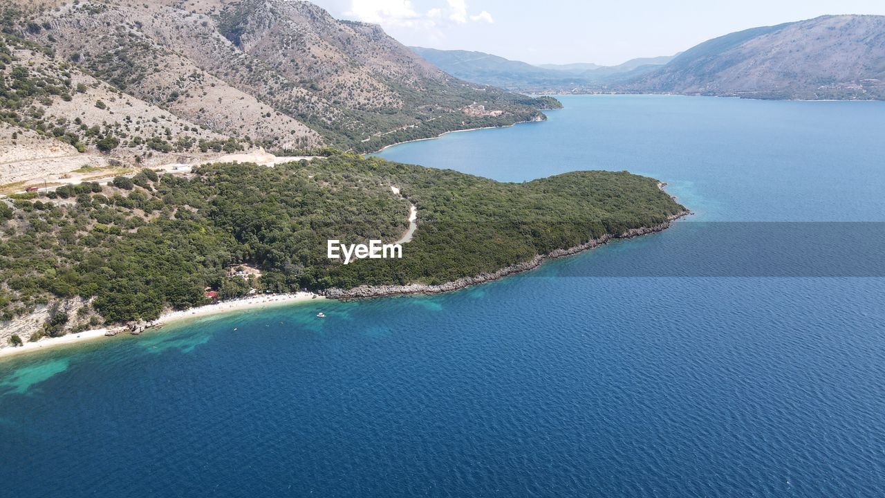 HIGH ANGLE VIEW OF BAY AND MOUNTAINS